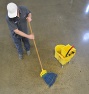 In-House Staff Cleaning Polished Concrete with Mop & Bucket