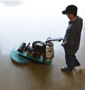 In-House Staff Cleaning Polished Concrete with Burnisher